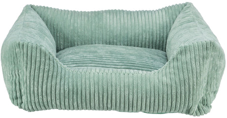 Rechteckiges, geripptes, hellgrünes Bett mit gepolsterten Seiten und einem weichen, strukturierten Finish.