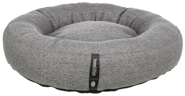 Graues, rundes Haustierbett mit schwarzem Etikett der Marke "homeEdition" von "Trixie".