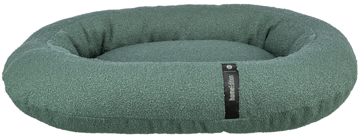 Rundes, grünes Hundebett mit hohem Rand und einer Label-Aufschrift "homeEdition" auf einem schwarzen Streifen.