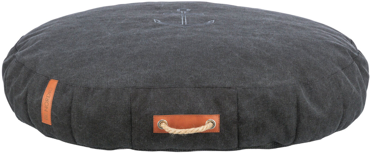 Rundes, dunkelgraues Kissen mit Anker-Motiv und braunem Lederetikett, seitlich ein Seilgriff.