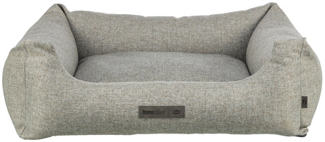 Graues, rechteckiges Hundebett mit erhöhten Seiten und sichtbarem Etikett mit der Aufschrift "homeEdition Trixie".