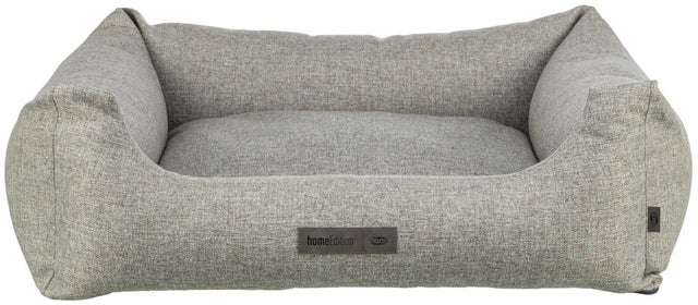 Graues, rechteckiges Hundebett mit erhöhten Seiten und sichtbarem Etikett mit der Aufschrift "homeEdition Trixie".