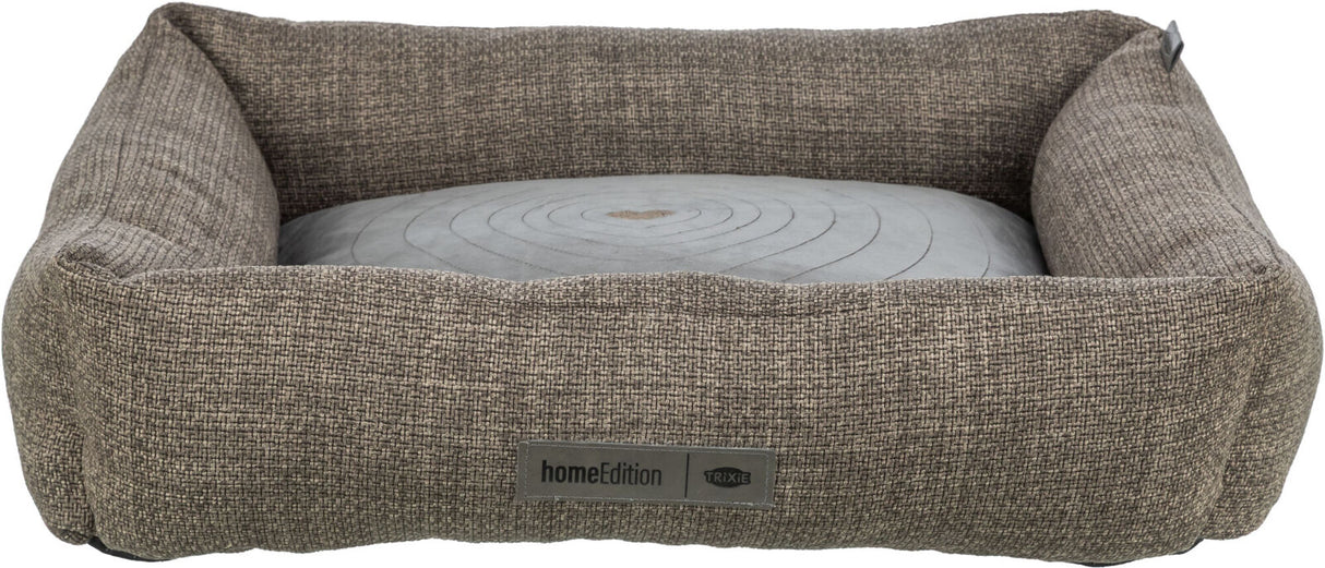 Rechteckiges, graues Hundebett mit umgebenen erhöhten Rändern aus strukturiertem Stoff, mit Logo „homeEdition“.