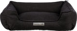 Rechteckiges, dunkelgraues Tierbett mit erhöhtem Rand und aufgenähtem Label "homeEdition Trixie".