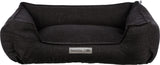 Rechteckiges, dunkelgraues Tierbett mit erhöhtem Rand und aufgenähtem Label "homeEdition Trixie".