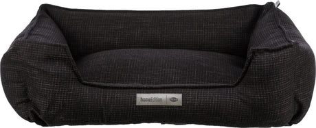 Rechteckiges, dunkelgraues Tierbett mit erhöhtem Rand und aufgenähtem Label "homeEdition Trixie".