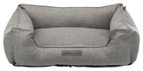 Graues Haustierbett in rechteckiger Sofaform mit erhöhtem Rand und einem Etikett "homeEdition Trixie".