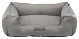 Graues Haustierbett in rechteckiger Sofaform mit erhöhtem Rand und einem Etikett "homeEdition Trixie".