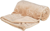 Beige Decke mit aufgedruckten Pfotenmustern, teilweise aufgerollt, weiches Material.
