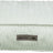 Rechteckiges, pastellgrünes Kissen mit wellenförmiger Struktur und Etikett "homeEdition Trixie" an der Seite.