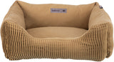 Braunes Tierbett mit gerippten Seiten und einem Label "home Edition Trixie" auf der Innenseite.