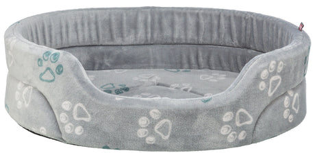 Rundes graues Tierbett mit erhöhtem Rand und Pfotenmuster in Weiß und Grün auf weicher Oberfläche.