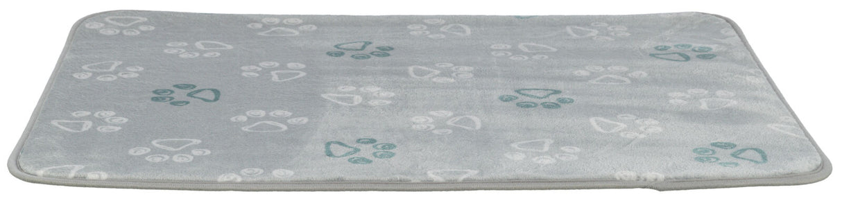 Graue rechteckige Matte mit weißen und grünen Pfotenabdrücken gleichmäßig verteilt auf der Oberfläche.