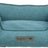 Ein rechteckiges, blaues Tierbett mit erhöhtem Rand, aus texturiertem Stoff, Vorderseite mit „homeEdition“ Label.