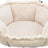Beige-weißes, sechseckiges Kissenbett mit weichem Plüschbezug und strukturierter Außenkante.