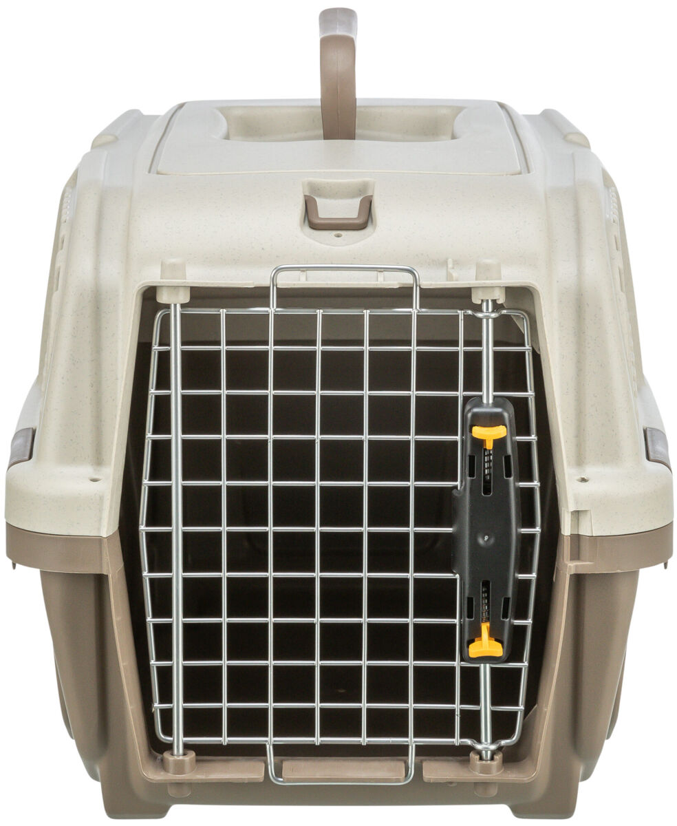 Beigefarbene Transportbox mit Metallgittertür und gelbem Verschluss, oberer Tragegriff sichtbar.
