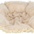 Beiges, rundes, flauschiges Kissen mit Fransenrand aus weichem Stoff, sichtbar von oben.
