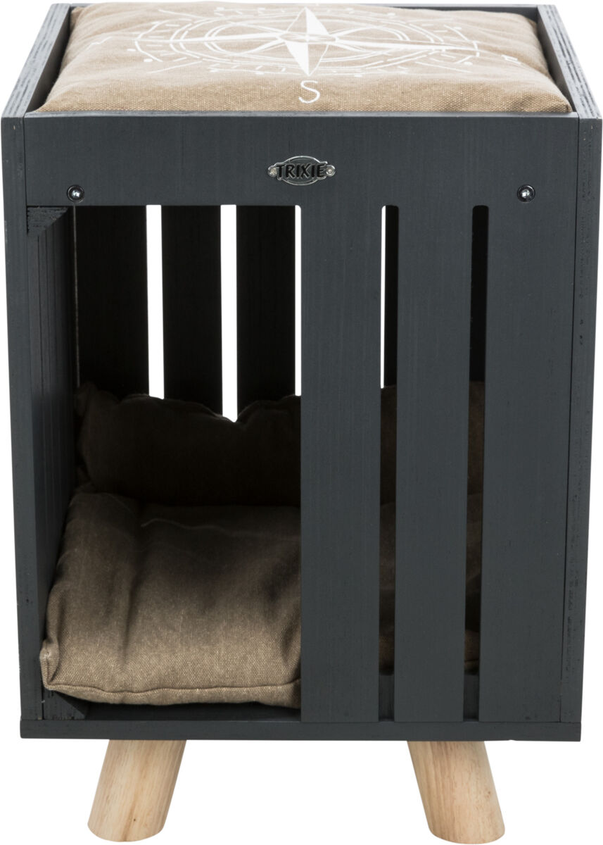 Schwarze Holzkiste auf Holzbeinen mit braunem Kissen oben, Aufschrift "TRIXIE".