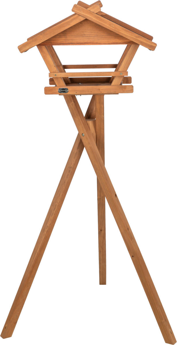 Holz-Vogelhaus auf drei Beinen mit schrägem Dach, naturfarben, ohne sichtbare Dekorationen oder Tiere.