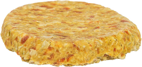 Runder, flacher, orangebrauner Gegenstand mit unregelmäßiger Oberfläche, erinnert an einen Burger-Pattie.