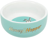 Türkise Schale mit weißem Rand und "Honey &amp; Hopper"-Aufschrift, innen ein Bild mit Tierohren.