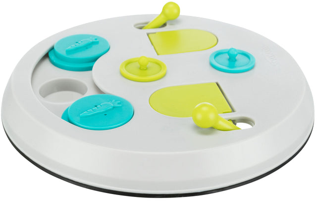 Runde, weiße Scheibe mit gelben und blauen beweglichen Elementen, teilweise mit einem Möhrenmotiv verziert.