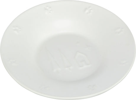 Weiße, runde Keramikschale mit geprägten Stern- und Hausmotiven sowie Pfotenabdrücken am Rand.