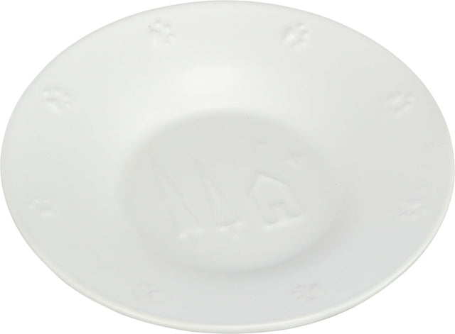 Weiße, runde Keramikschale mit geprägten Stern- und Hausmotiven sowie Pfotenabdrücken am Rand.