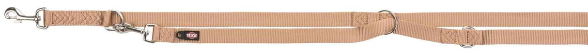 Beige Leine mit Metallhaken und -ringen sowie einem Trixie-Label, aus Nylongewebe mit Nähten.