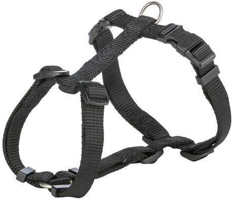 Ein schwarzes, verstellbares Hundegeschirr mit Schnallen und D-Ring aus robustem Material.