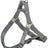 Graues Hundegeschirr mit verstellbaren Gurten und Metallringen, aus robustem Material gefertigt.