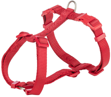 Rotes Hundegeschirr mit verstellbaren Gurten und Metallring, kein Tier sichtbar.