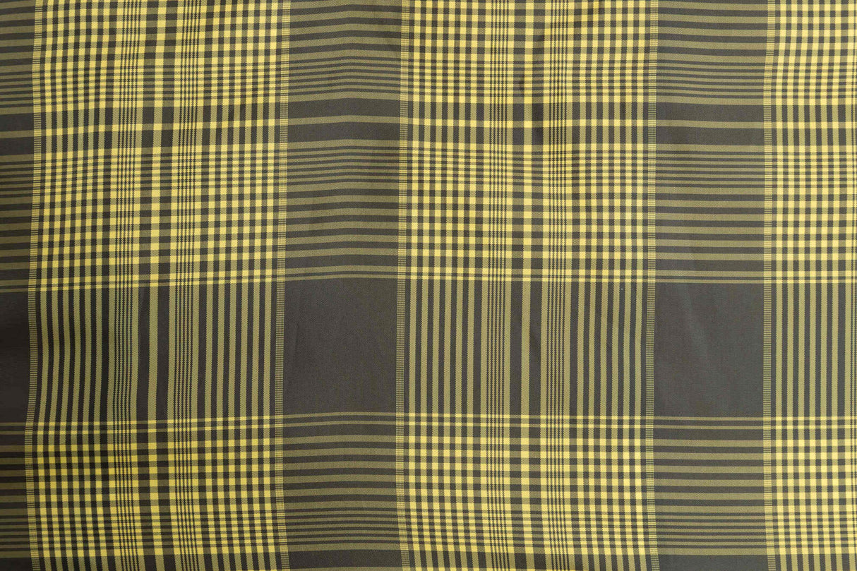 Karomuster mit wechselnden hellgelben und dunkelgrauen Streifen in einem geometrischen, sich wiederholenden Design.