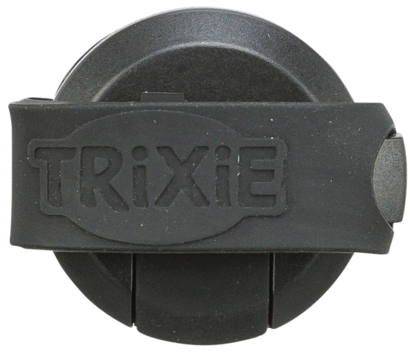 Rundes, schwarzes Objekt mit dem erhabenen Schriftzug "Trixie" auf einem Band in der Mitte.