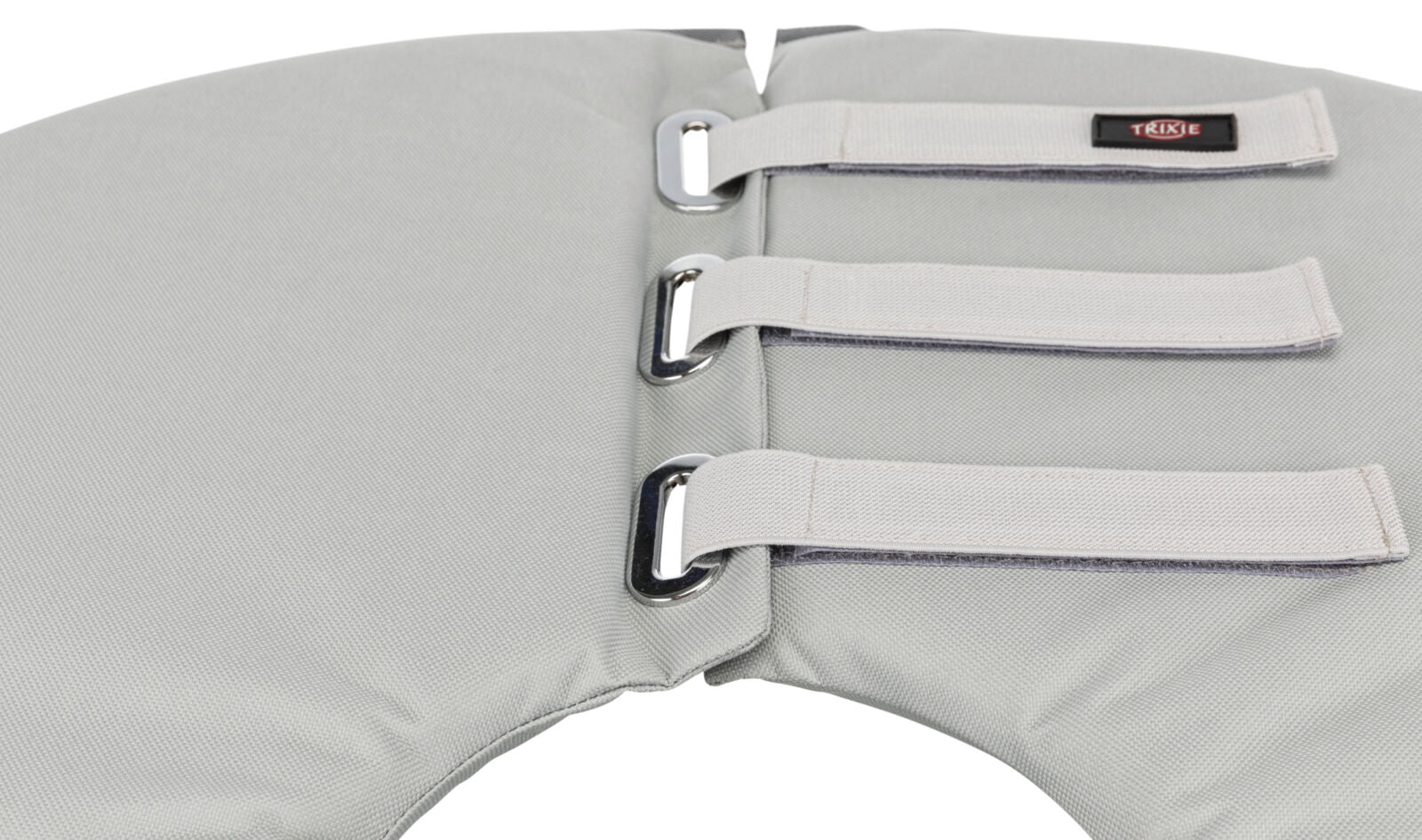 Grauer gepolsterter Kragen mit drei Klettverschlüssen und Metallösen, Label "TRIXIE" auf einem Verschluss.