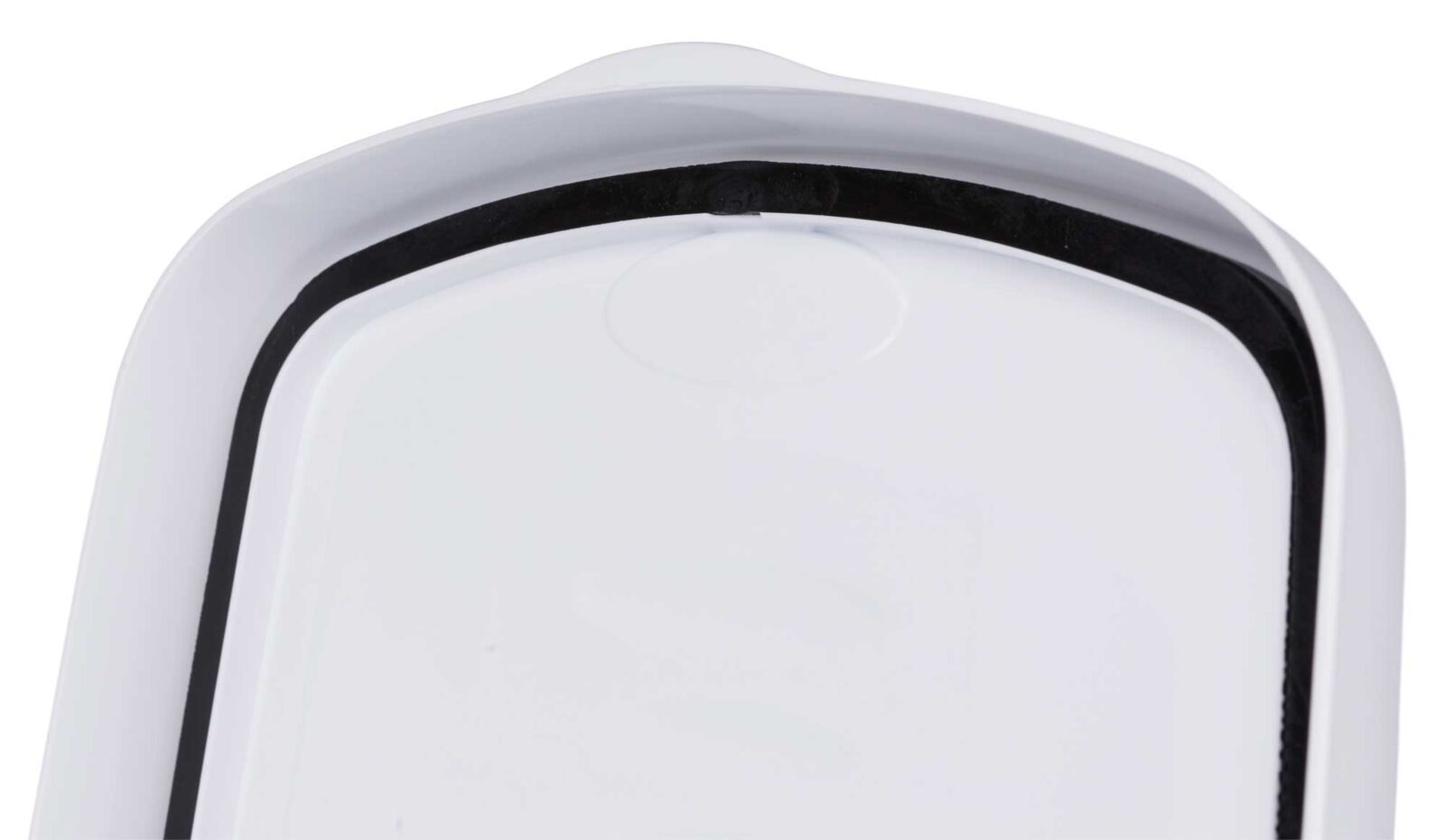 Weiße ovale Oberfläche mit schwarzer Gummidichtung entlang des Randes, Ansicht von oben.