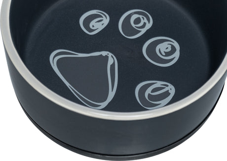 Dunkler Napf mit hellen Pfotenabdruck-Motiven im Inneren, runde Form, metallisch erscheinender Rand.