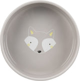 Grauer Teller mit einem stilisierten Fuchs-Gesicht in der Mitte, gelbe Ohren und Wangenakzente.