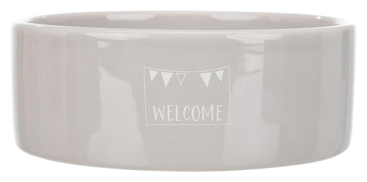 Graue Keramikschale mit dem weißen Schriftzug "WELCOME" und kleinen Dreiecken darüber.