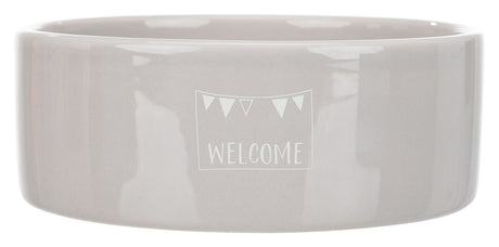 Graue Keramikschale mit dem weißen Schriftzug "WELCOME" und kleinen Dreiecken darüber.