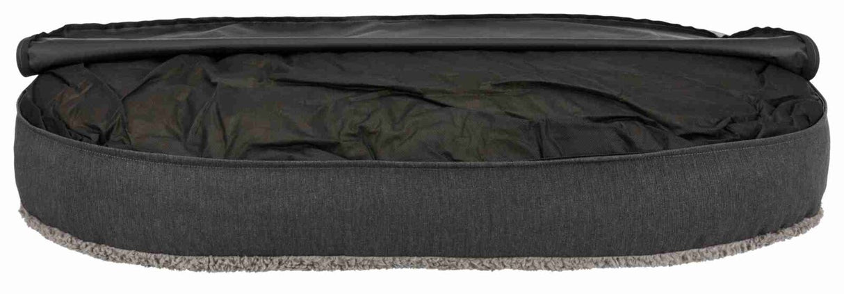 Ein ovales, dunkelgraues Sitzkissen mit abgerundeten Kanten und weichem Futter an der Unterseite.