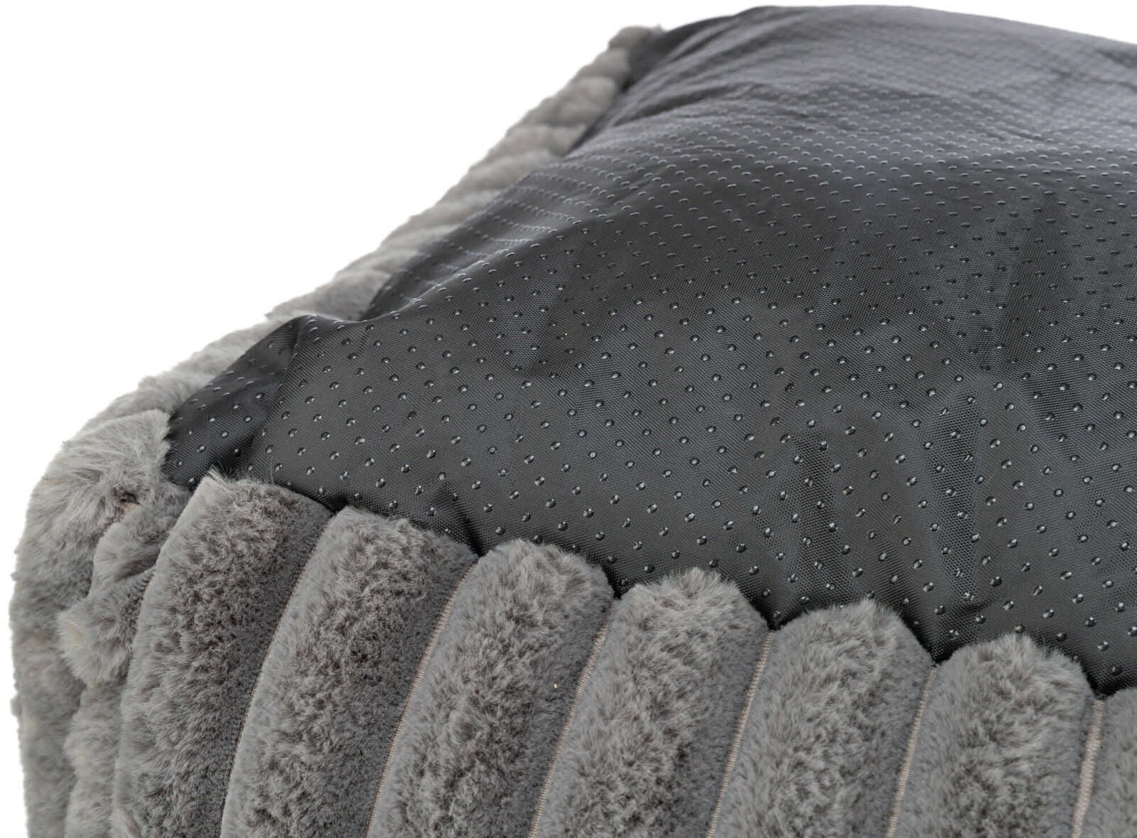 Grauer, strukturierter Stoff mit weicher, plüschiger Oberfläche und glatter, gepunkteter Unterseite.