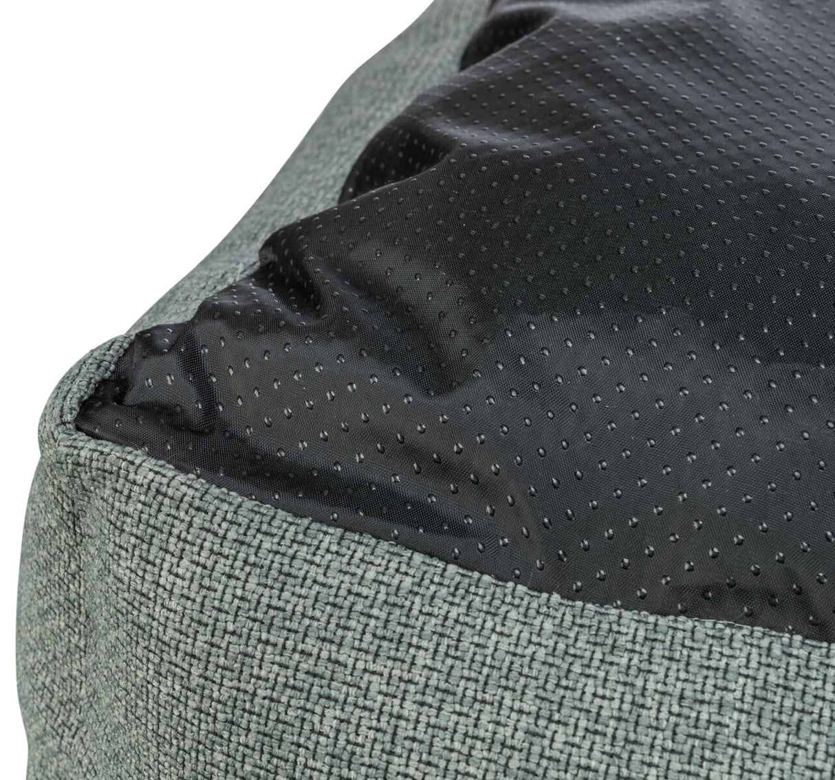 Graues Textilgewebe mit schwarzem, gepunktetem Stoff, Nahaufnahme.