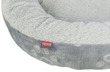 Graues, rundes Bett mit flauschigem Rand, sichtbarer Text "TRIXIE" auf rotem Etikett.