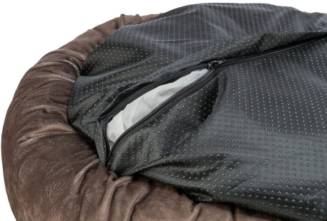 Runder brauner Stoff mit schwarzer, gepunkteter Abdeckung und Reißverschluss.