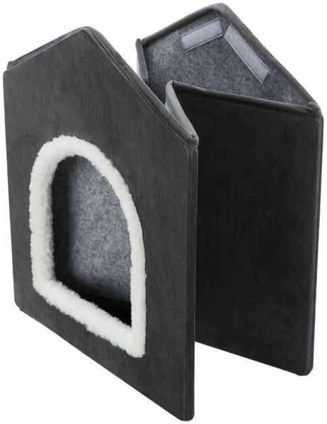 Dreieckige, faltbare Höhle in Schwarz mit weißem Rand um den Eingang, grau gefüttertes Inneres und Klettverschlüsse.