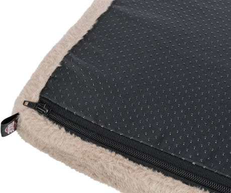 Schwarzes Unterlage mit rutschfester, genoppter Oberfläche und beige flauschigem Rand, Reißverschluss an der Seite.