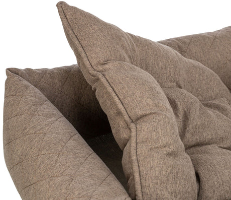 Graues, gepolstertes Kissen mit gesteppter Oberfläche liegt auf einer weiteren gepolsterten Struktur.