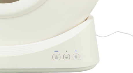 Weißes Gerät mit drei Knöpfen und blauen Lichtern, rechteckiger Rahmen und Kabel an der Seite.