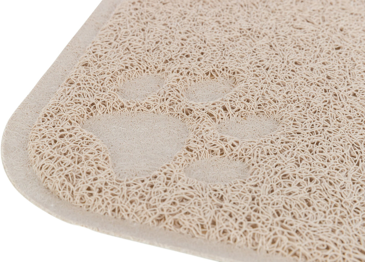 Beige Matte mit spiralförmiger Textur und sichtbarem Pfotenabdruckmuster in der Nahaufnahme.